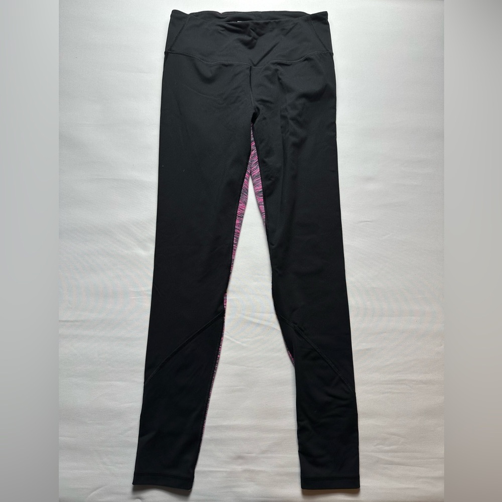 VSX Sport. Size M black leggings with pink pattern on back.